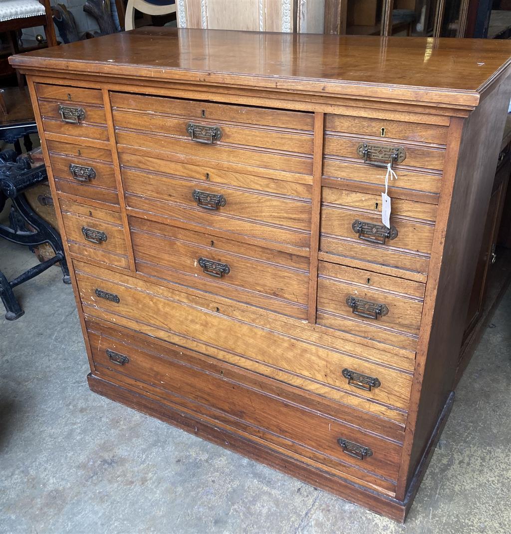 An Edwardian walnut eight drawer chest, width 122cm depth 57cm height 119cm